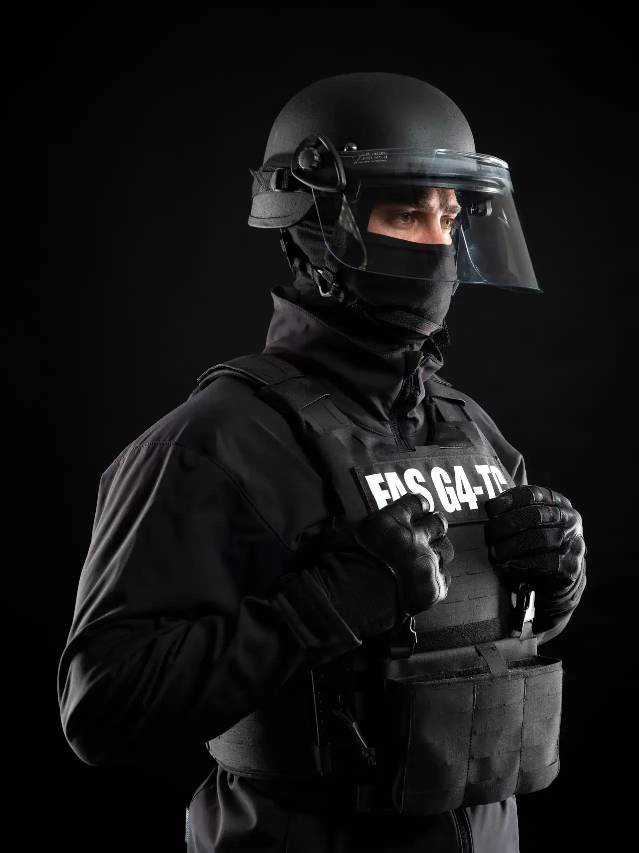 Law enforcement officer using tactical face and body protection